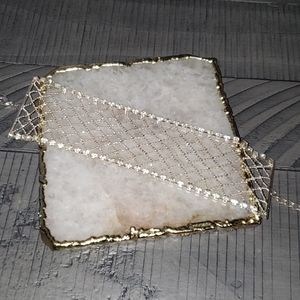 Silver bracelet with stones along edge